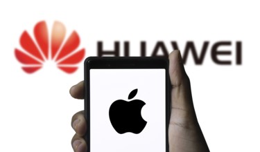 Apple Vs Huawei logo on a smartphone