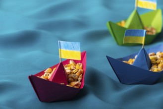 Ships with Ukrainian maize grain made of paper concept, food photography, food photography