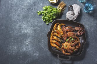 Food, Grilled spimps, squids and octopus in cast iron grill pan