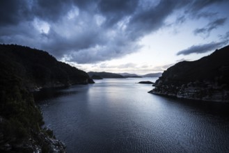View of the Gordon Dam on a cool summer's day. It is a unique double curvature concrete arch dam