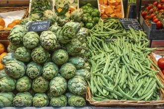 Artichokes and beans for sale at a market