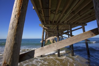 Newport pier beach in California USA seen from below