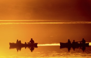 Sunset Sillouette Canoe orange color Saskatchewan Canada
