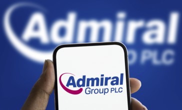 Admiral group plc logo is displayed on smartphone