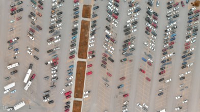 Car park full of vehicles. Panoramic bird's eye view
