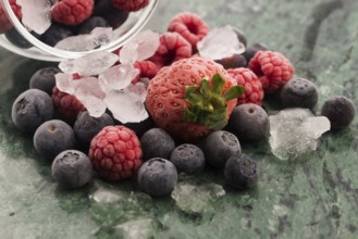 Closeup shot of frozen raspberries, blackberries and strawberries