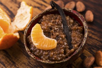 A bowl of chocolate tapioca pudding with fruits