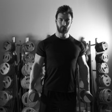 Dumbbell man workout fitness club at weightlifting gym