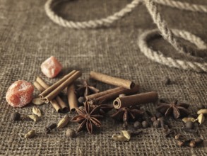 Spice mix for hot wine over the burlap background