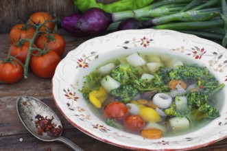 Big bowl of vegetable soup seasoned with hot spices