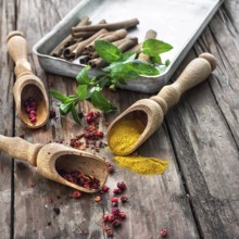 Set of different spices on the old wooden table.Photo rustic
