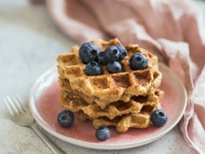 Easy healthy gluten free oat waffles with copy space. Stack of appetizing homemade waffles with oat