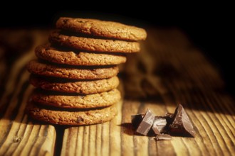 Chocolate chip cookies and cookies with oat flakes or oatmeal on the old wooden table