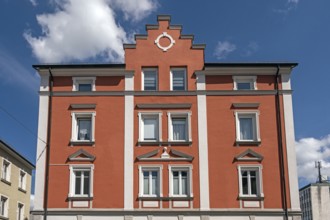 Red classicist façade with stepped gable, Kempten, Allgäu, Swabia, Bavaria, Germany, Europe