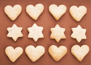 Holiday cookies as a background pattern on brown