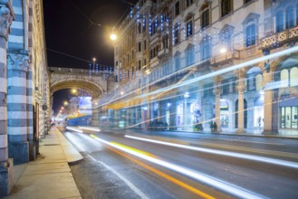 Main Street in Long Exposure with Traffic and Buildings at Night with Light Trails in City of