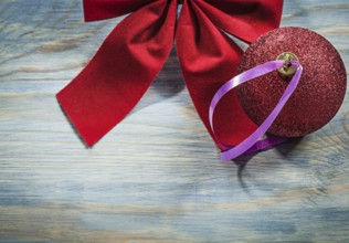 Set of red Christmas bow ball on wooden board holidays concept