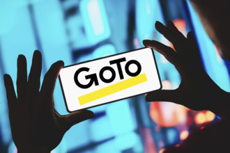 In this photo illustration, the GoTo Meeting logo is displayed on a smartphone screen
