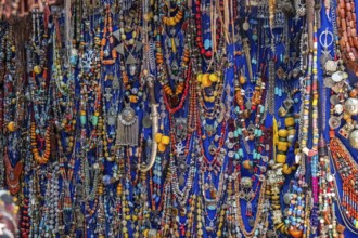 Necklaces and jewels of colored stones in a shop in a souk in the Medina in Marrakech. Morocco