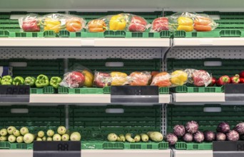 Stand with fruits and vegetables in the supermarket