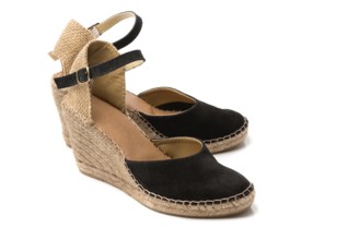 Pair of beige with black suede women's summer shoes. Isolate on white