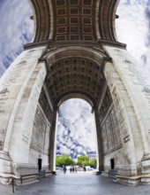 The striking and unexpected angle Arc de Triomphe in Paris. Background - the cloudy sky. Photo was