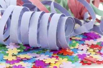 Paper colorful party streamers on tiny flowers