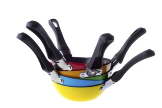 Many stacked colorful frying pans isolated over white