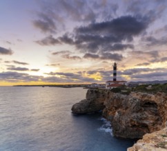 A view of the Portocolom Lighthouse in eastern Mallorca at sunset
