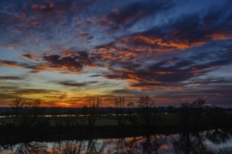 An atmospheric sunset with bright colours and a beautiful reflection in the water, Bogen, Lower