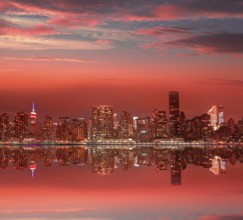 Manhattan New York skyline at sunset dusk from East River NYC USA