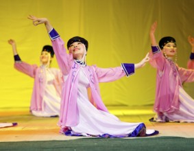ULAN-UDE, RUSSIA - APRIL 16: Unidentified Buryat female dancers in national dresses perform at