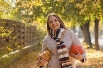 Portrait of happy smile woman with pumpkins in hand. Cozy autumn vibes Halloween, Thanksgiving day