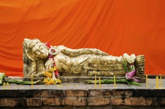 Reclining buddha statue with gold leaf in thailand