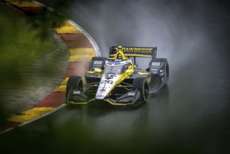 COLTON HERTA (26) of Valencia, California comes through turn 12 (Canada Corner) during a wet