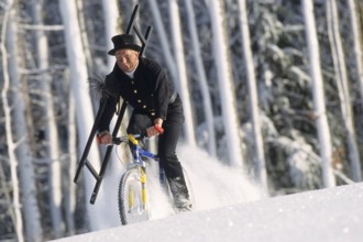 Chimney sweep on a mountain bike in winter, chimney sweep, chimney sweep