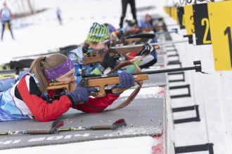 Kamchatka sportswoman biathlete Valentina Vakhrusheva rifle shooting in prone position. Biathlete