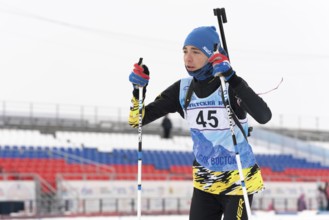 Kamchatka sportsman biathlete Storonkin Nikita skiing on distance biathlon stadium. Open regional