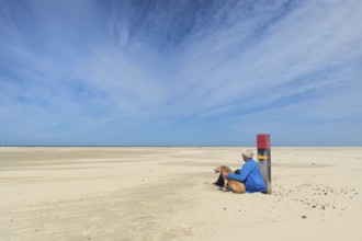 Walking the dog at the beach
