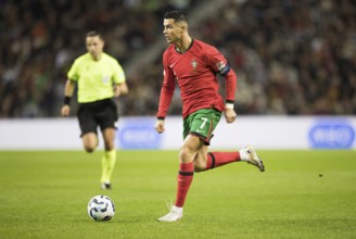 Football match, captain Cristiano RONALDO CR7 Portugal on the ball running towards the left looking
