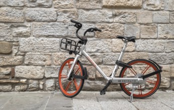 Mobike bicycle meant for bike sharing, parked in public area. Mobike a popular bike sharing