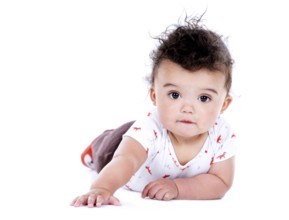 Adorable baby boy wrapped with blanked on white background, Toronto, Canada, North America
