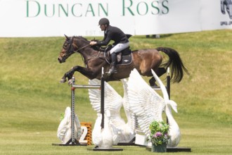 Kyle King of the United States and riding Odysseus, compete in the 1.60m Grand Prix during The