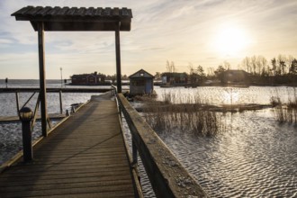 Harbour by the lake, landscape shot in autumn. Holiday village and harbour by the water in Sunnana