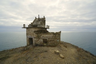 Autumn morning and mountain landscape by the sea, old lighthouse on the cliff