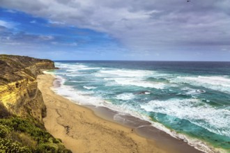 Great Ocean Road of Australia. Picturesque ocean bay with clear green water. The coastal cliffs are