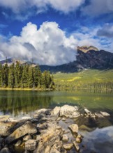 Transparent autumn morning in Jasper National Park, Canada. The woody small island in Pyramid Lake
