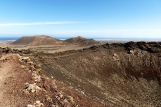 Impressive volcanic landscape with dry craters and vast skies in a natural setting. Beautiful