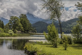 Lake Weissensee to the west of Füssen in the district of Ostallgäu, with the Ammergau Alps and the