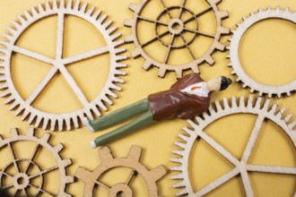 Industrial composition. Man with cogwheel gears